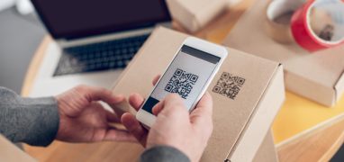 online store employee scanning information on the product package